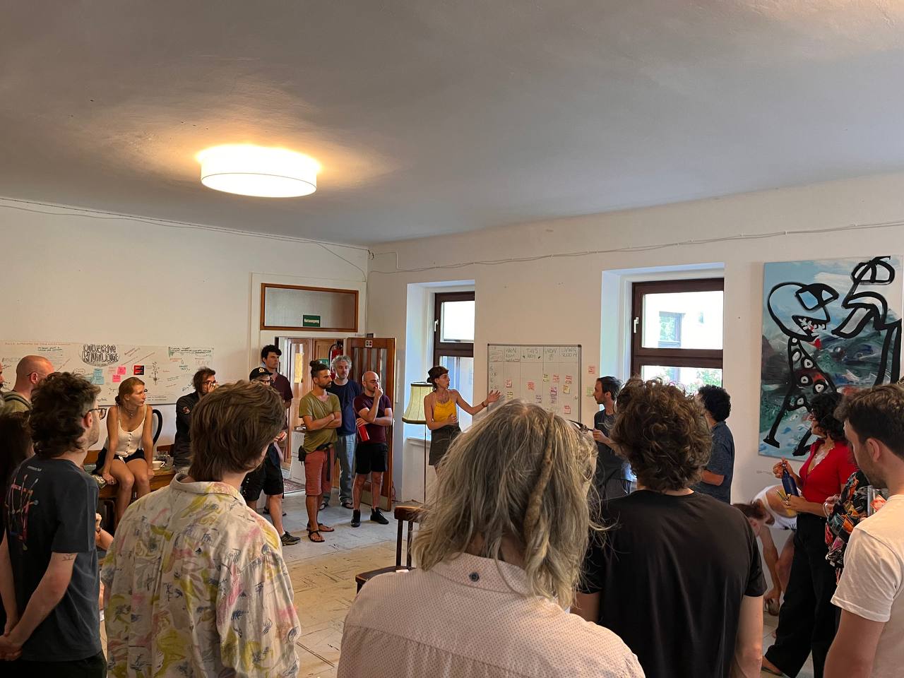 A group of people in a workshop circle.